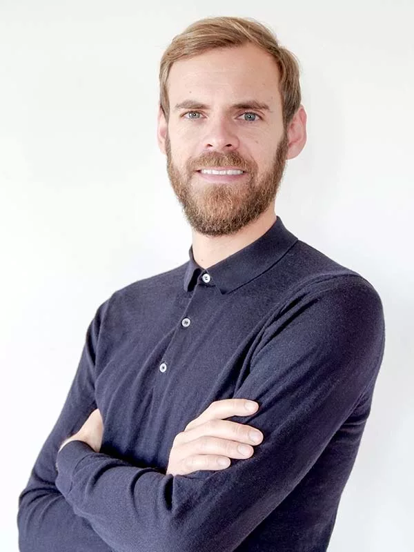 Man in a shirt, arms crossed